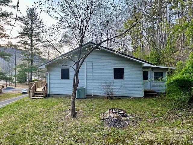 5381 State Highway 197 S Unit 3, Burnsville, NC 28714 - view of home's exterior with a lawn, central air condition unit, and an outdoor fire pit