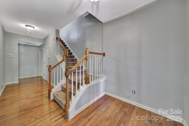 9862 Walkers Glen Dr NW, Concord, NC 28027 - staircase with wood finished floors and baseboards