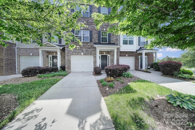 9862 Walkers Glen Dr NW, Concord, NC 28027 - view of front of house featuring brick siding, driveway, and a garage