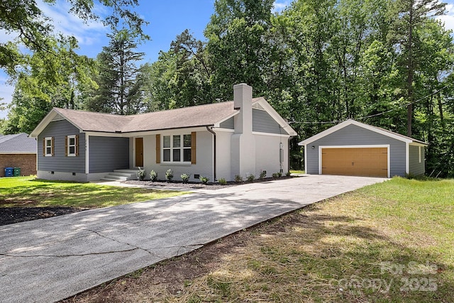 single story home featuring a garage, a front yard, crawl space, a chimney, and an outdoor structure