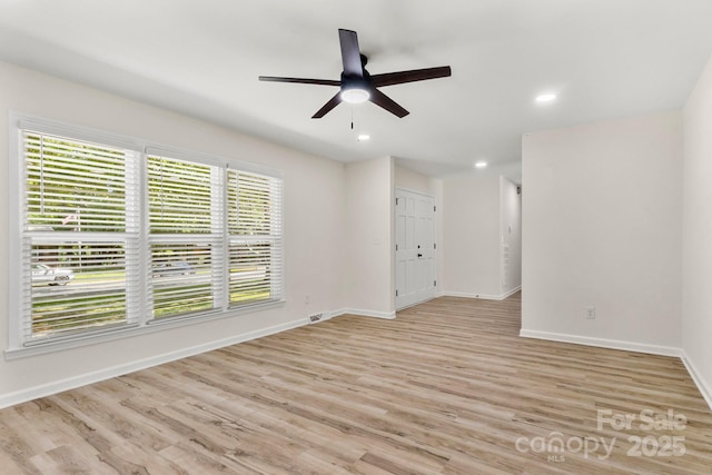unfurnished room featuring recessed lighting, baseboards, ceiling fan, and light wood-type flooring