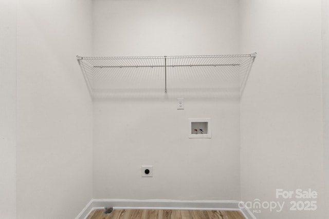 washroom featuring washer hookup, laundry area, light wood-type flooring, and electric dryer hookup