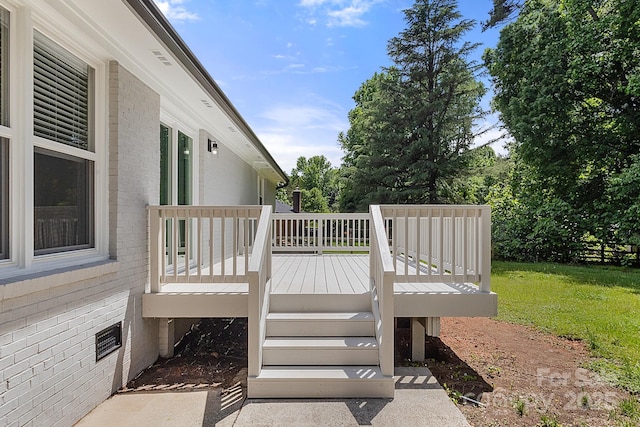 deck featuring a yard