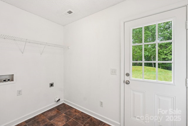 washroom with washer hookup, laundry area, hookup for an electric dryer, and a healthy amount of sunlight