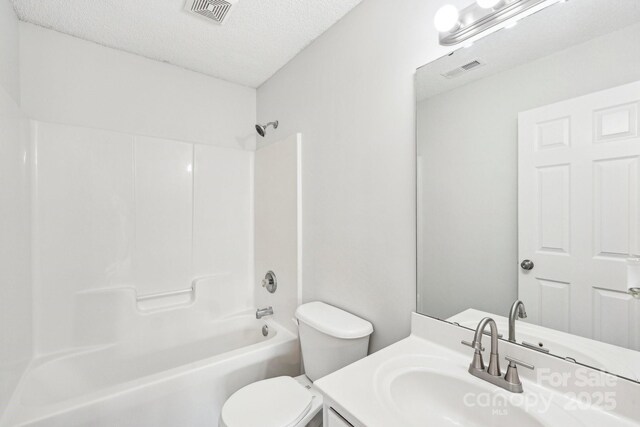 bathroom with shower / bathtub combination, visible vents, toilet, and vanity