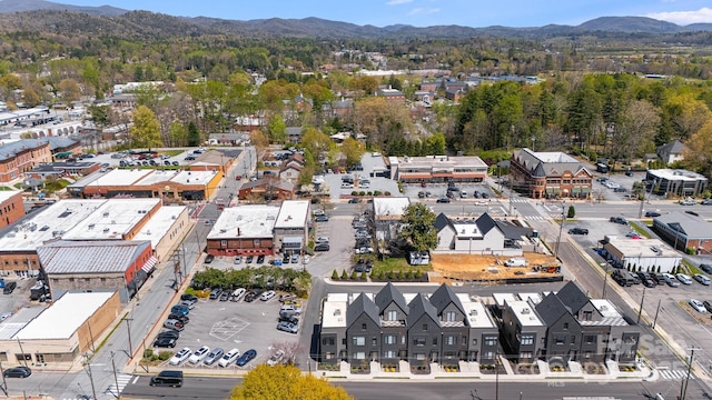 drone / aerial view featuring a residential view and a mountain view