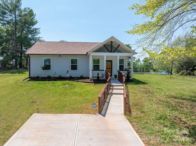 3121 Suffolk Dr, Shelby, NC 28152 - view of front of home featuring a front yard, covered porch, and a shingled roof