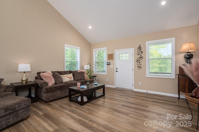 3121 Suffolk Dr, Shelby, NC 28152 - living area featuring wood finished floors, baseboards, plenty of natural light, recessed lighting, and high vaulted ceiling