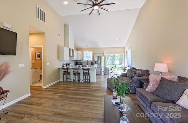 3121 Suffolk Dr, Shelby, NC 28152 - living room with high vaulted ceiling, a ceiling fan, wood finished floors, and baseboards