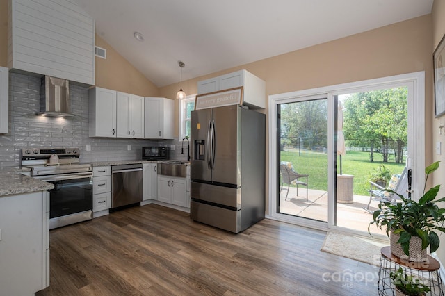 3121 Suffolk Dr, Shelby, NC 28152 - kitchen featuring stainless steel appliances, wall chimney exhaust hood, tasteful backsplash, dark wood finished floors, and high vaulted ceiling