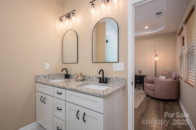 3121 Suffolk Dr, Shelby, NC 28152 - bathroom with baseboards, wood finished floors, and double vanity