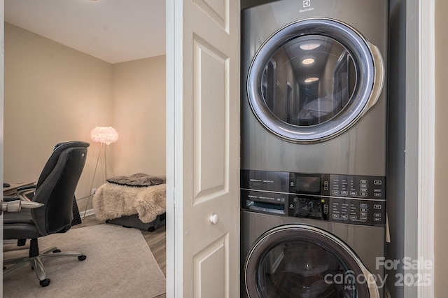 3121 Suffolk Dr, Shelby, NC 28152 - laundry area with stacked washer / drying machine, wood finished floors, and an office area