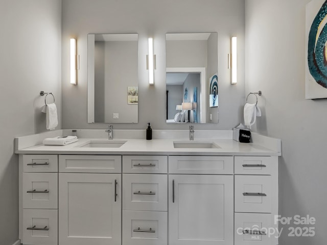 bathroom with double vanity and a sink