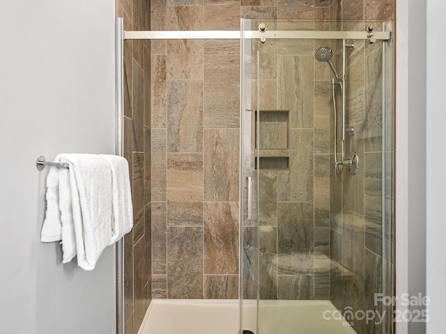full bath with a shower stall