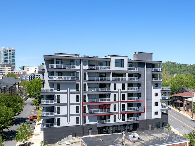 view of property featuring uncovered parking