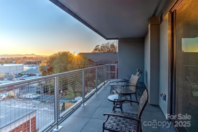 view of balcony at dusk