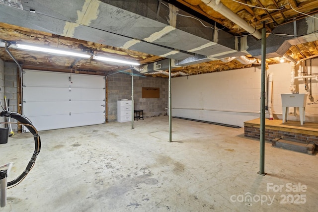 garage with concrete block wall