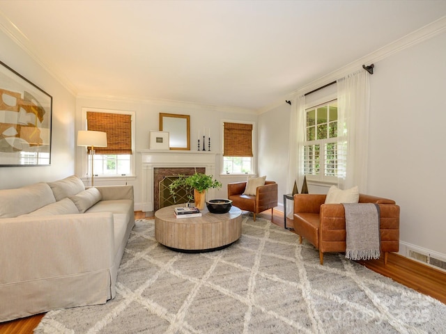 1596 Clayton Dr, Charlotte, NC 28203 - living area featuring plenty of natural light, ornamental molding, and light wood-type flooring