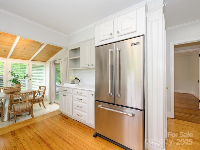 1596 Clayton Dr, Charlotte, NC 28203 - kitchen with open shelves, light wood-style flooring, high end fridge, and white cabinetry