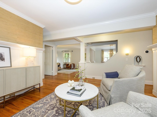 1596 Clayton Dr, Charlotte, NC 28203 - living room with baseboards, ornamental molding, decorative columns, and wood finished floors