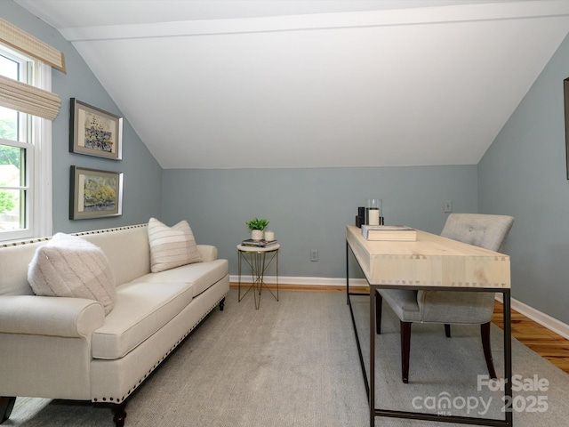 1596 Clayton Dr, Charlotte, NC 28203 - home office featuring baseboards, vaulted ceiling, and light wood-type flooring