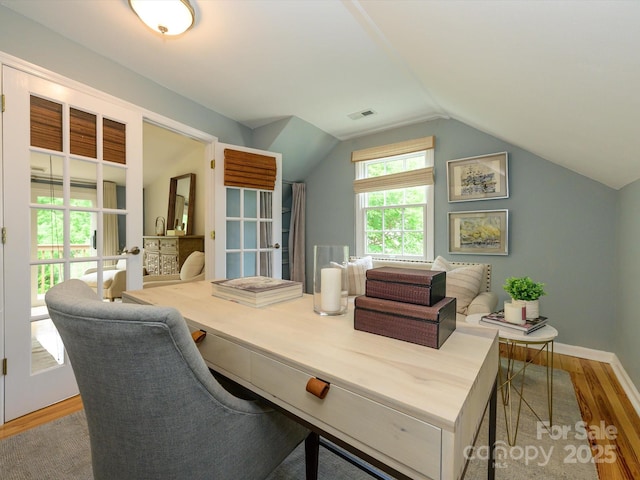1596 Clayton Dr, Charlotte, NC 28203 - home office with baseboards, visible vents, wood finished floors, and lofted ceiling