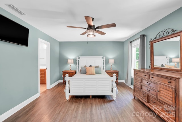 2417 Labelle Dr, Waxhaw, NC 28173 - bedroom featuring wood finished floors, baseboards, a ceiling fan, and connected bathroom