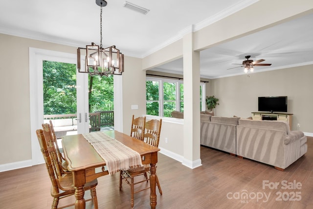 2417 Labelle Dr, Waxhaw, NC 28173 - dining space featuring plenty of natural light, baseboards, wood finished floors, and ornamental molding