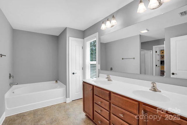 2417 Labelle Dr, Waxhaw, NC 28173 - full bathroom featuring double vanity and a garden tub