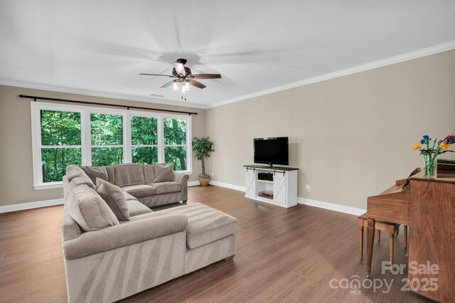 2417 Labelle Dr, Waxhaw, NC 28173 - living area with ceiling fan, crown molding, and dark wood-style flooring