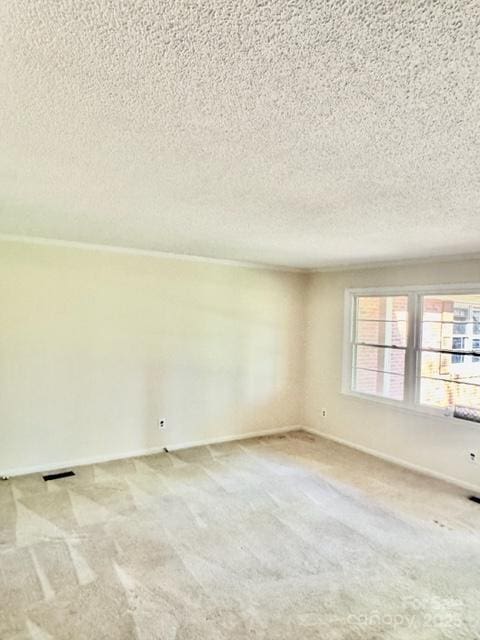 127 Edgeway Rd, Mooresville, NC 28117 - empty room featuring carpet, a textured ceiling, and baseboards