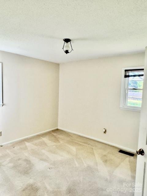 127 Edgeway Rd, Mooresville, NC 28117 - unfurnished room with light carpet, baseboards, and a textured ceiling