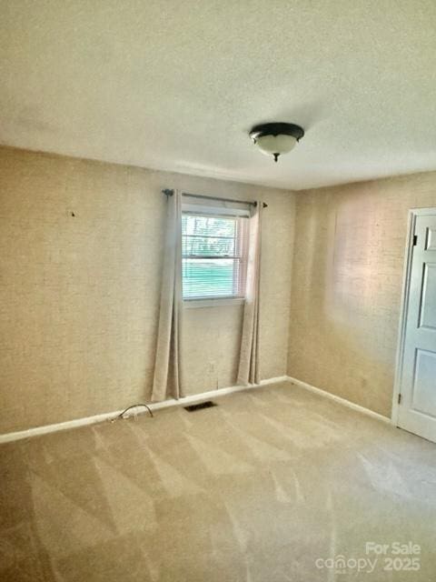 127 Edgeway Rd, Mooresville, NC 28117 - unfurnished room with carpet flooring, a textured ceiling, and baseboards