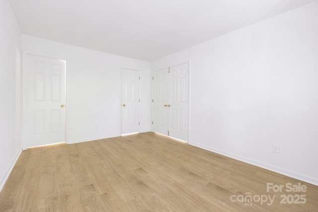 6523 Clavell Ln Unit I, Charlotte, NC 28210 - spare room featuring baseboards and light wood finished floors