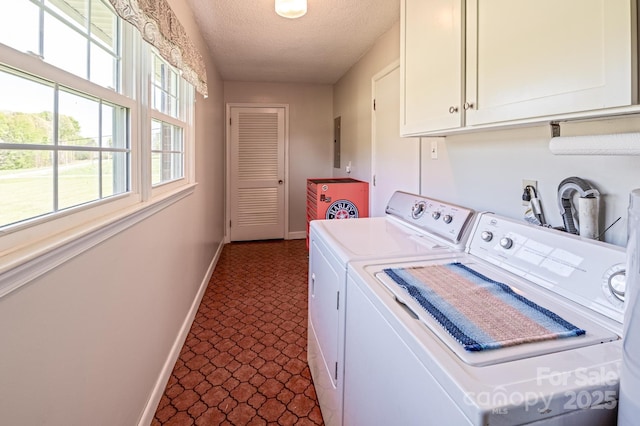 153 Coachman Loop, Statesville, NC 28625 - washroom featuring cabinet space, baseboards, washer and dryer, a textured ceiling, and dark floors