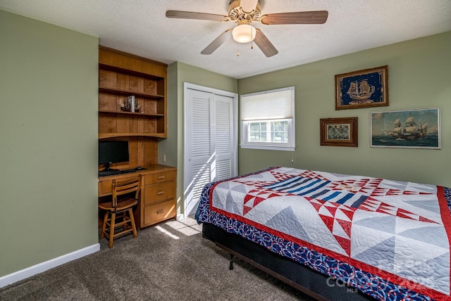 153 Coachman Loop, Statesville, NC 28625 - bedroom featuring dark carpet, a textured ceiling, a closet, ceiling fan, and baseboards