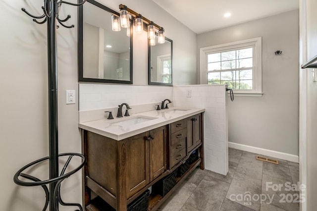 153 Coachman Loop, Statesville, NC 28625 - full bath featuring backsplash, baseboards, and double vanity