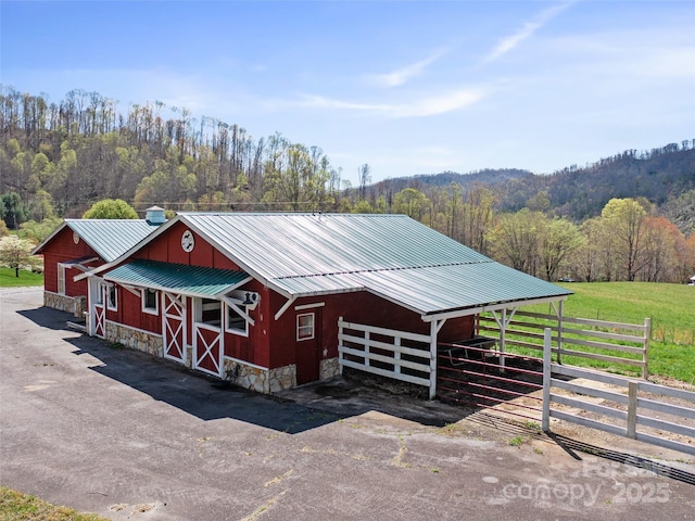 173 Odoms Chapel Rd, Bakersville, NC 28705 - view of outbuilding with an exterior structure, an outdoor structure, and a forest view