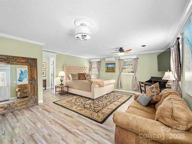 173 Odoms Chapel Rd, Bakersville, NC 28705 - bedroom featuring wood finished floors, a textured ceiling, a wall mounted AC, baseboards, and ornamental molding
