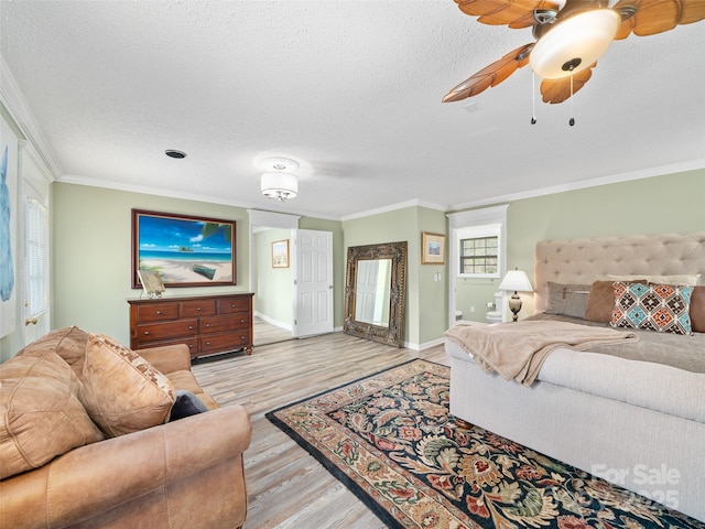 173 Odoms Chapel Rd, Bakersville, NC 28705 - bedroom with baseboards, a textured ceiling, light wood-style floors, and crown molding