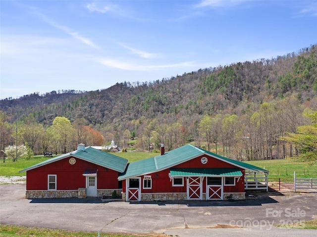 173 Odoms Chapel Rd, Bakersville, NC 28705 - exterior space with a forest view, fence, and a barn