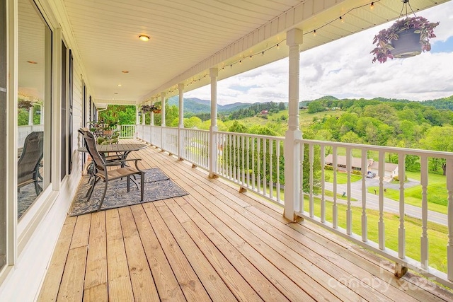 wooden terrace with a mountain view