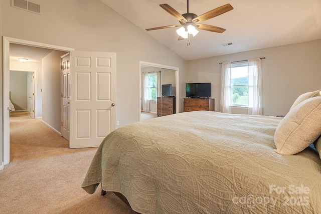 bedroom featuring ceiling fan, light carpet, visible vents, and high vaulted ceiling