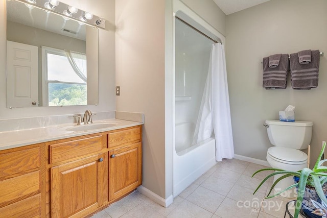 bathroom with tile patterned floors, toilet, baseboards, and vanity