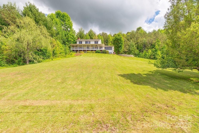 view of yard with a wooded view