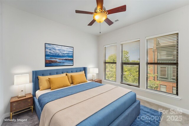 562 New Bern Station Ct, Charlotte, NC 28209 - carpeted bedroom featuring baseboards and a ceiling fan
