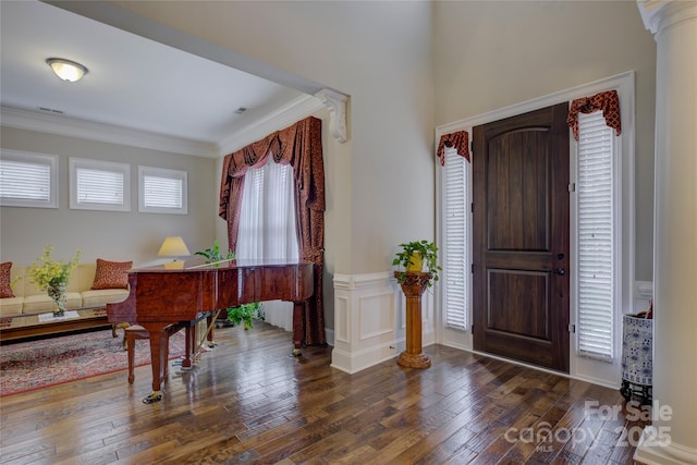 foyer featuring crown molding and hardwood / wood-style floors