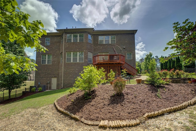 back of property featuring a deck, central air condition unit, brick siding, fence, and stairs