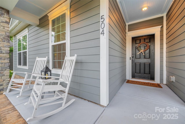 doorway to property featuring a porch