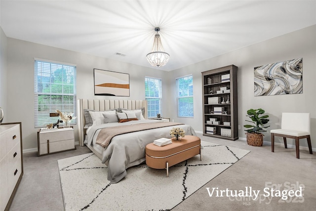 504 Gardenbrook Trl, Belmont, NC 28012 - bedroom with carpet floors, multiple windows, and a chandelier